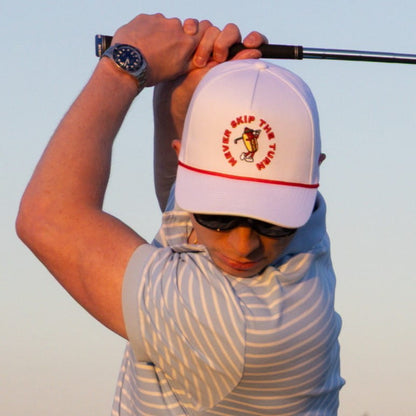 man in hot dog golf hat