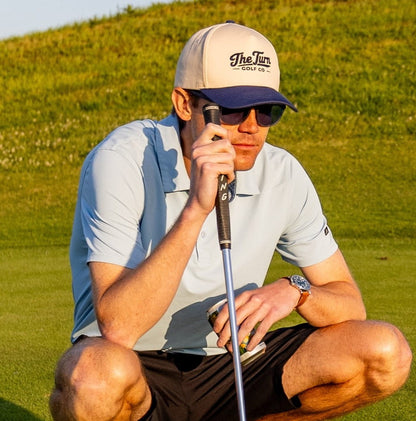 man in navy two tone golf hat